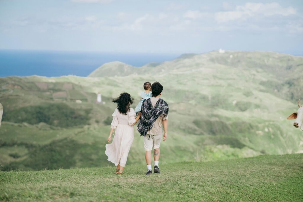 A family strolls through the lush, scenic hills of Cagayan Valley, Philippines.